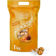 Lindt šokoladas, LINDOR šokolado rutuliukai su karamele, 1 kg maišelis, sandariai uždaromas, apie 80 rutuliukų pieniško šokolado su karamelės kremo įdaru, dovana su pralinija